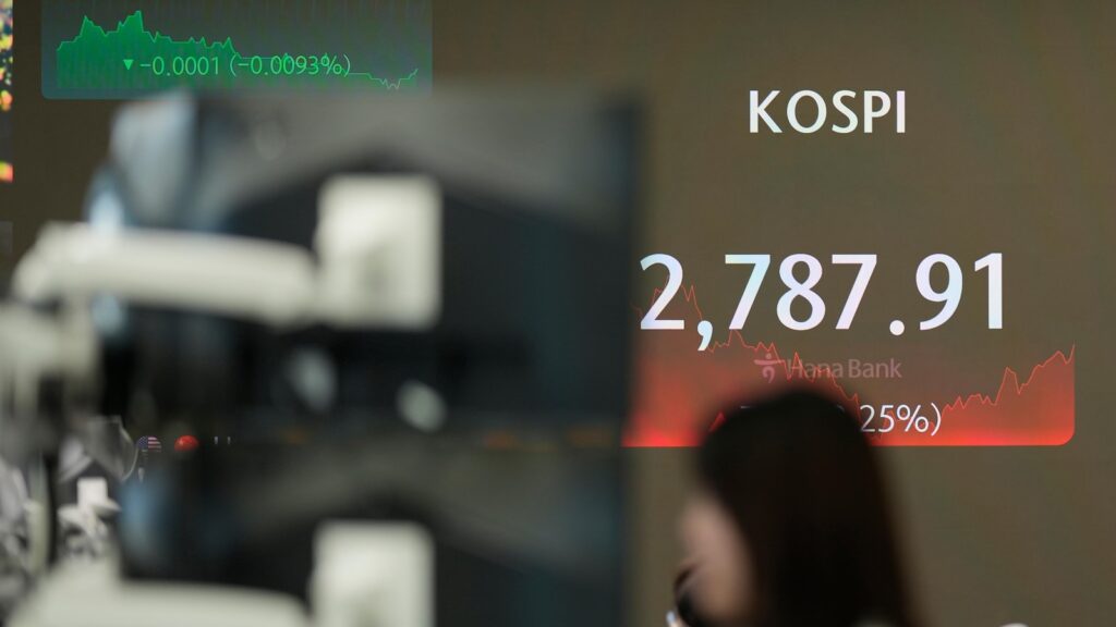 Stock market today: Wall Street hits records as a slowing economy boosts hopes for lower rates