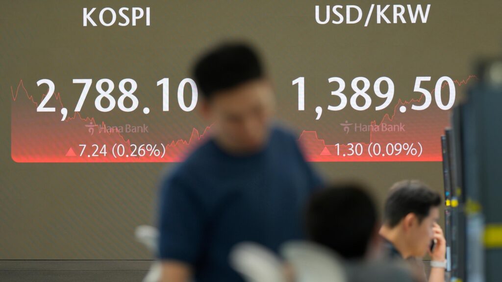 Stock market today: Asian shares mostly rise, boosted by Wall Street records as Tesla zooms