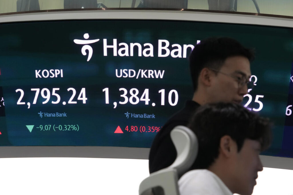 Asian shares are mixed after gains on Wall Street