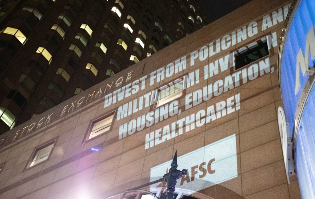 Anti-war message projected on the Chicago Stock Exchange during DNC