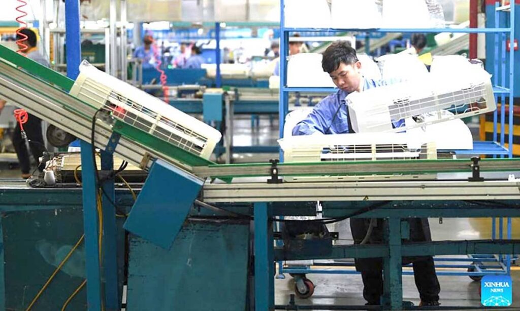 GO BIG A man works at a workshop of Midea Group in Guangzhou, Guangdong province, on March 3, 2023. Midea Group announced on Sept. 8, 2024 it is planning to raise HK$27 billion ($3.46 billion) in its IPO at the Hong Kong Stock Market, the biggest offered to the bourse for the year. XINHUA PHOTO