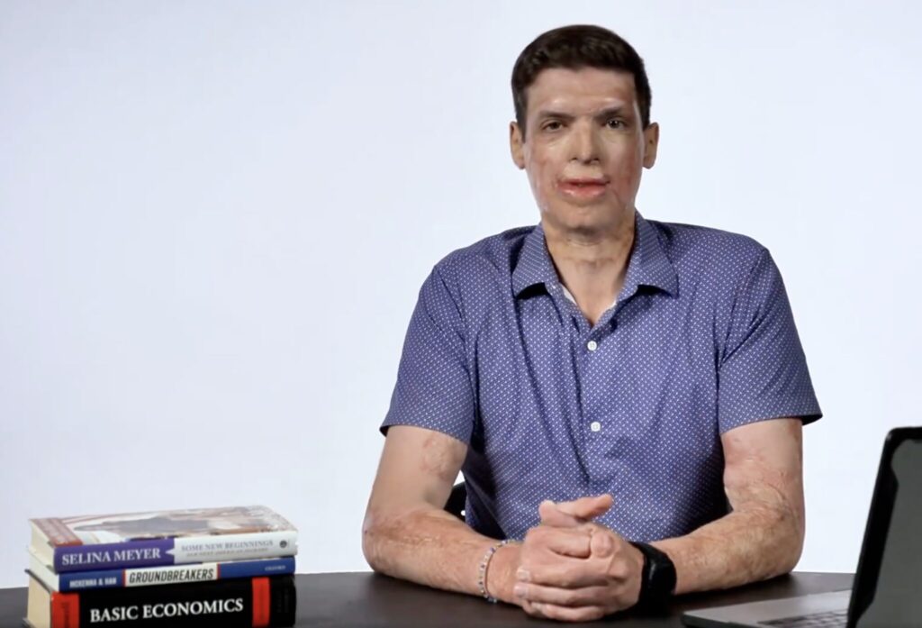 Brown poses with make-believe book while pretending to be on Home Shopping Network • Nevada Current