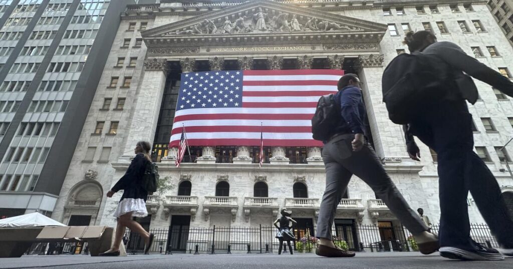 Dow sets a record as Wall Street gears up for a cut to interest rates