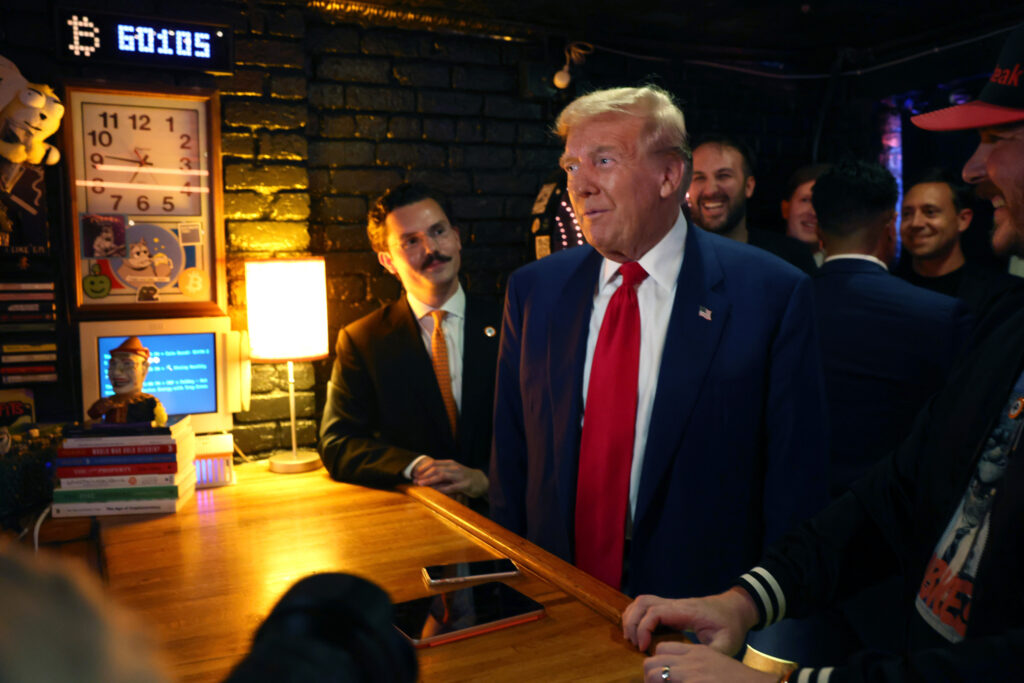 Donald Trump visits a crypto-themed bar.