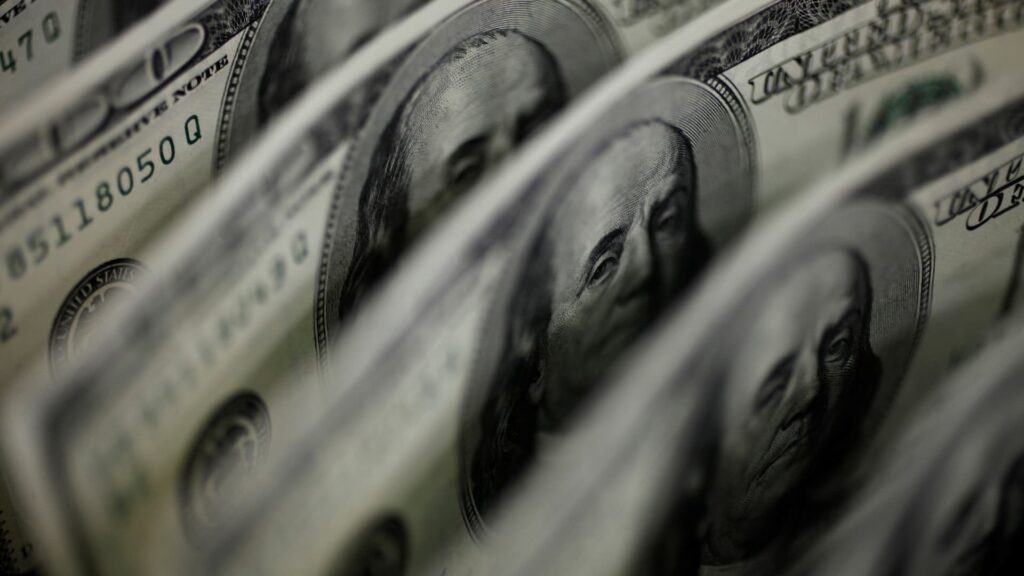 Dollar flat against peers as markets digest U.S. economic data