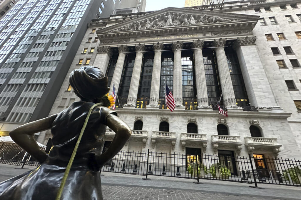 Wall Street finishes mixed after Tesla soars and IBM slumps