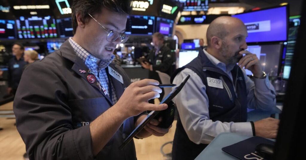 Wall Street cruises to more records, closing its best week in a year