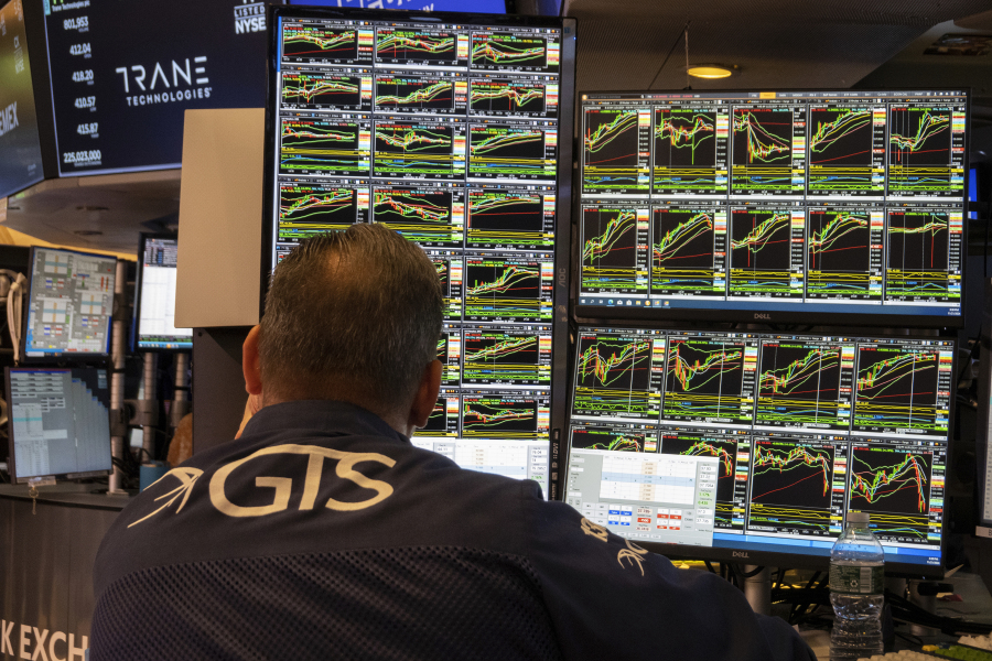 FILE - A specialist studies monitors on the New York Stock Exchange trading floor in New York on November 21, 2024.